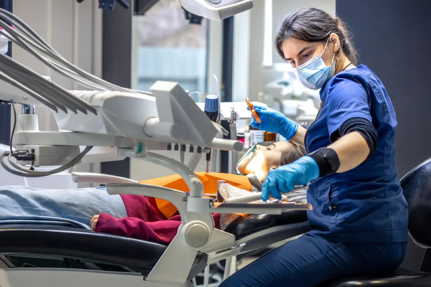A dentist examining a patient