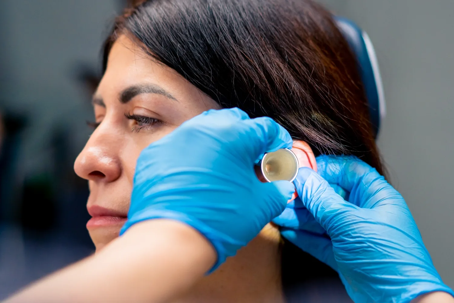 An ear examination with an otoscope
