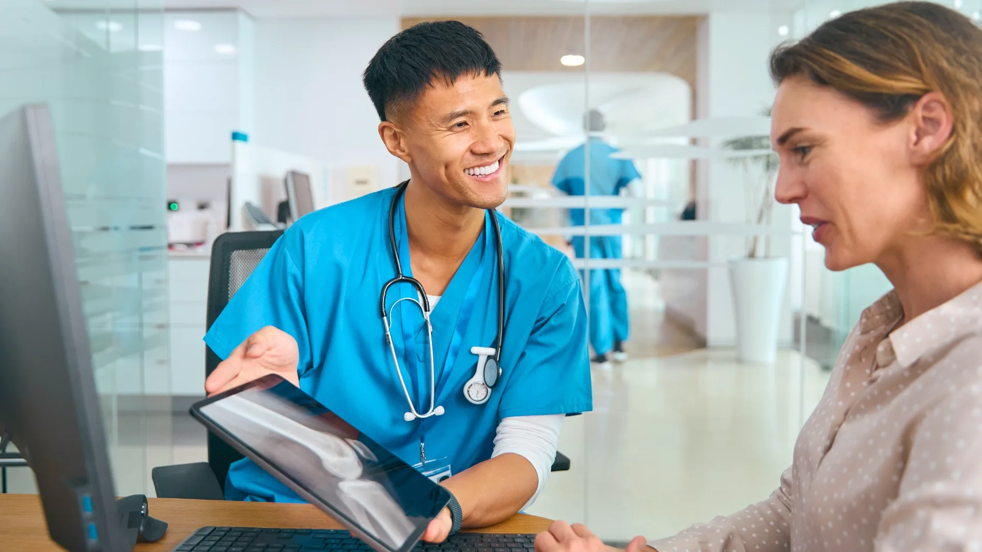 A clinician discussing information with a patient