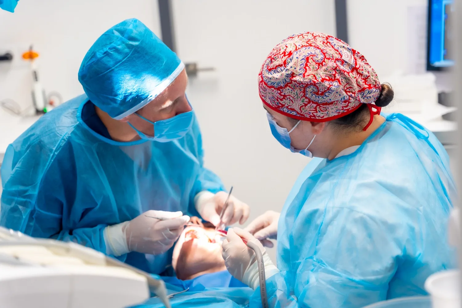 A dental team treating a patient