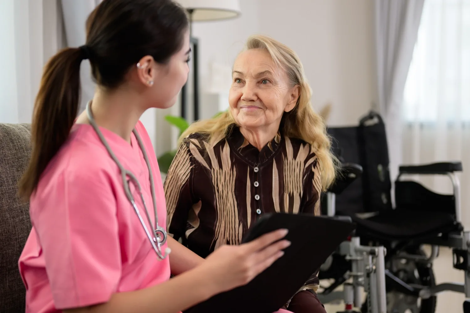 A clinician discussing information with an older patient