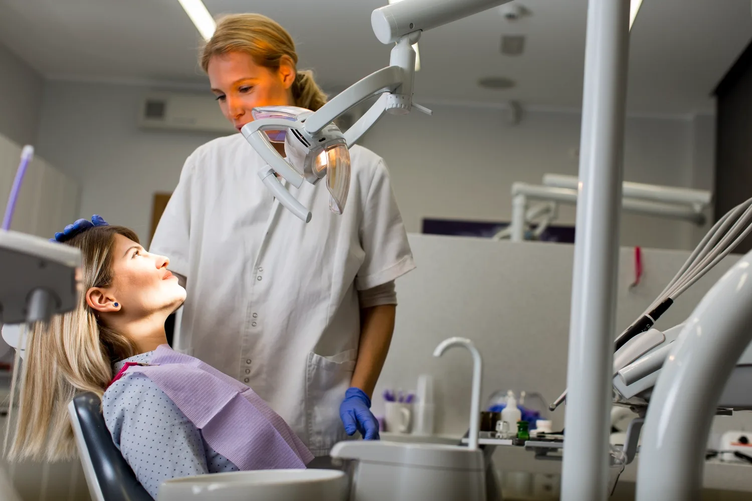 A dentist discussing care with a patient